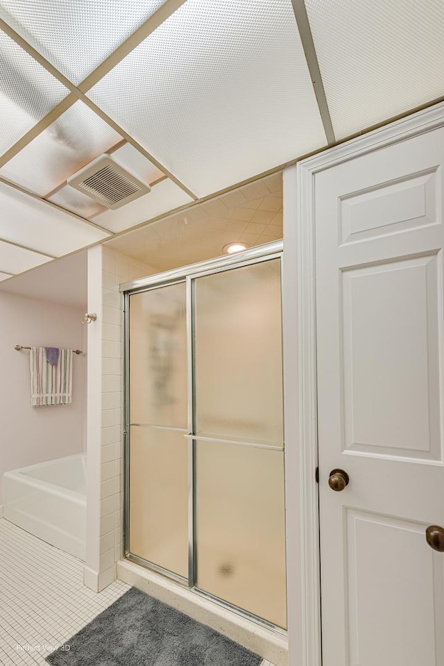 2 S Atrium Way Unit 407, Elmhurst, IL 60126 - bathroom featuring an enclosed shower, tile patterned flooring, and a bathtub