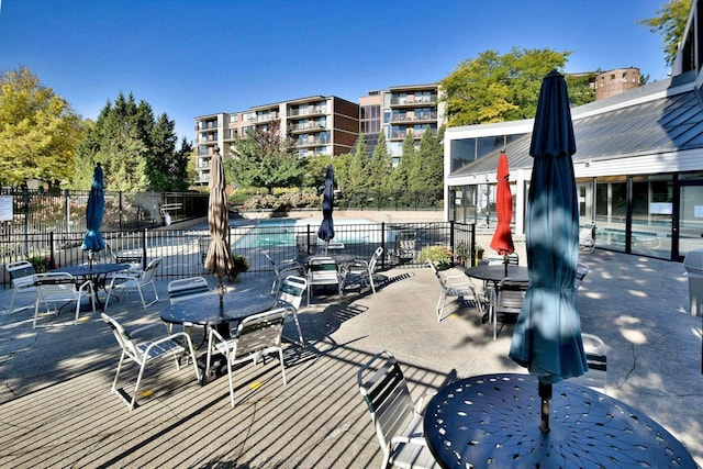 2 S Atrium Way Unit 407, Elmhurst, IL 60126 - view of patio / terrace with outdoor dining space and a community pool