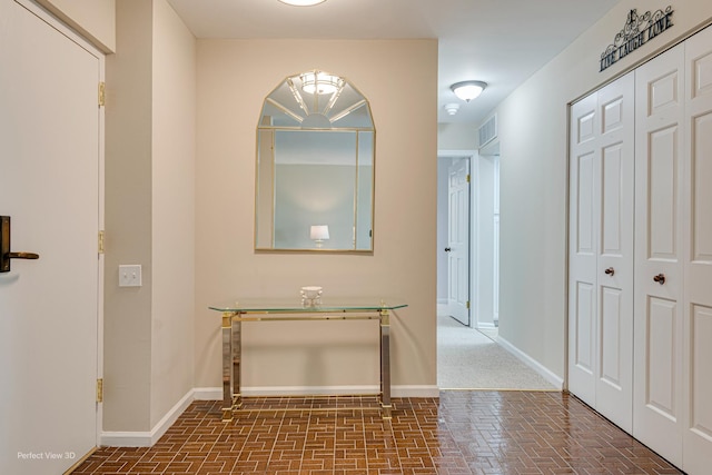 2 S Atrium Way Unit 407, Elmhurst, IL 60126 - corridor featuring brick patterned flooring and baseboards