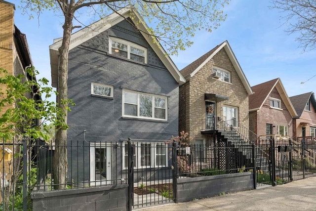 2534 W Haddon Ave, Chicago, IL 60622 - view of front of house featuring a gate, a fenced front yard, and brick siding