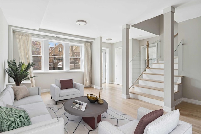 2534 W Haddon Ave, Chicago, IL 60622 - living area with stairs, light wood-style flooring, and baseboards