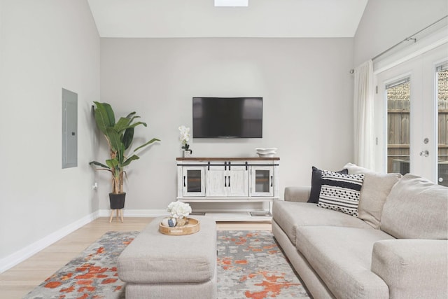 2534 W Haddon Ave, Chicago, IL 60622 - living room with wood finished floors, electric panel, lofted ceiling, baseboards, and french doors