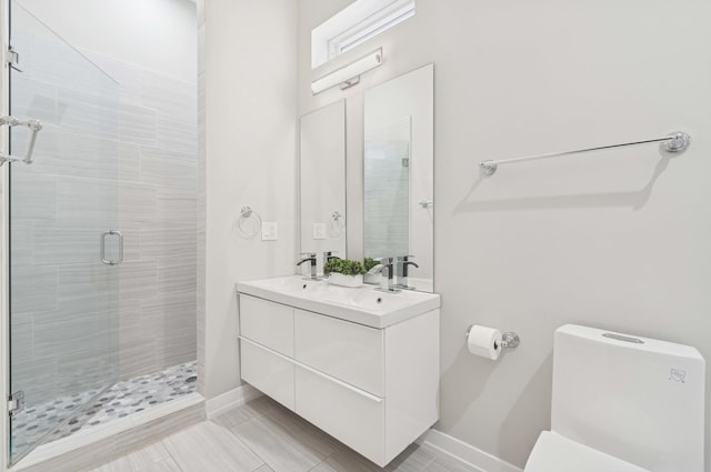 2534 W Haddon Ave, Chicago, IL 60622 - full bathroom with a stall shower, baseboards, toilet, and double vanity
