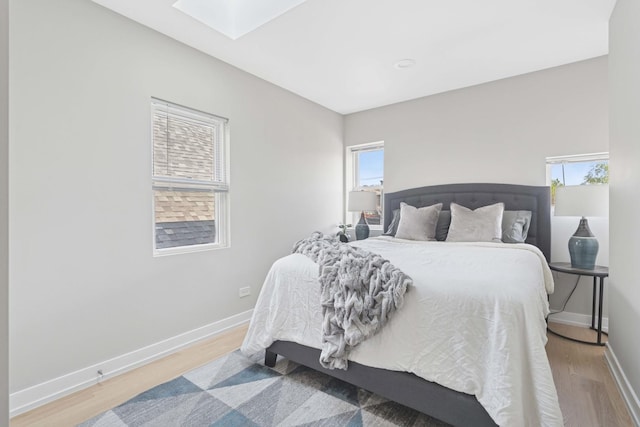 2534 W Haddon Ave, Chicago, IL 60622 - bedroom with a skylight, wood finished floors, and baseboards