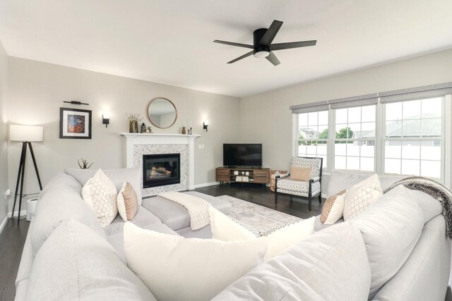 1811 Partridge Pt, Normal, IL 61761 - living area featuring dark wood-style flooring, baseboards, a ceiling fan, and a fireplace