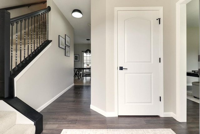 1811 Partridge Pt, Normal, IL 61761 - hallway featuring dark wood-type flooring, baseboards, and stairs