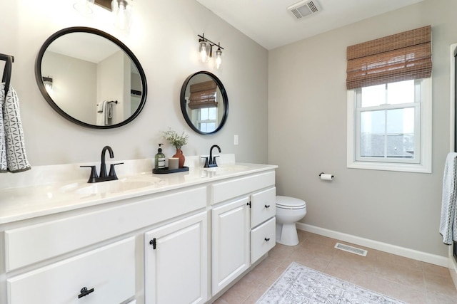 1811 Partridge Pt, Normal, IL 61761 - bathroom with double vanity, tile patterned floors, baseboards, and toilet