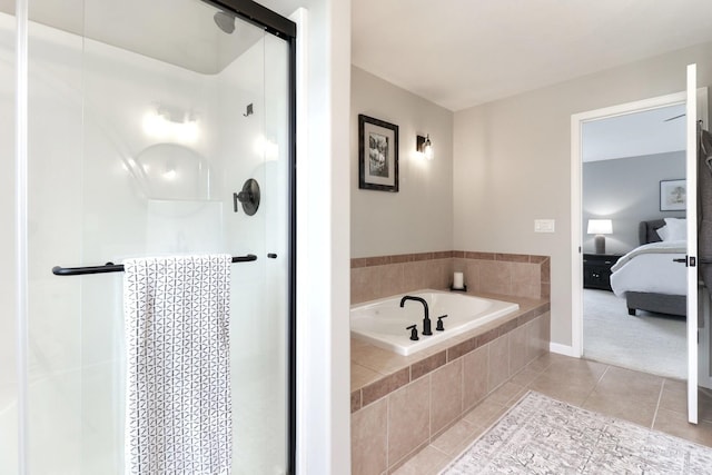 1811 Partridge Pt, Normal, IL 61761 - bathroom with ensuite bathroom, a shower stall, tile patterned flooring, and a garden tub