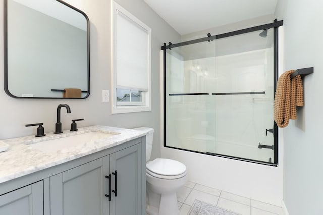 1811 Partridge Pt, Normal, IL 61761 - full bath with vanity, shower / bath combination with glass door, toilet, and tile patterned floors