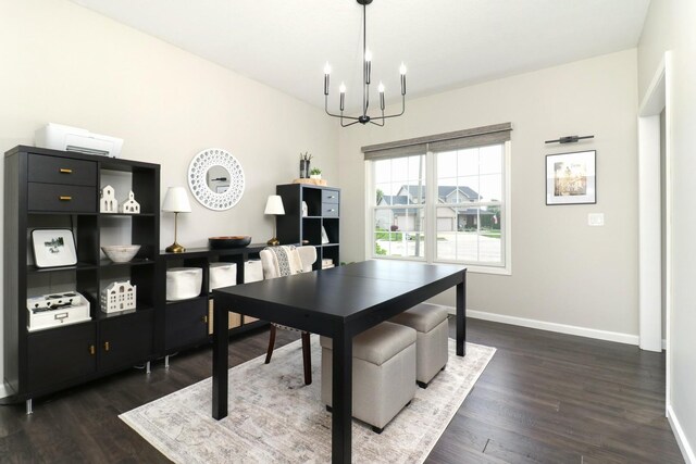 1811 Partridge Pt, Normal, IL 61761 - dining room with a chandelier, dark wood-type flooring, and baseboards