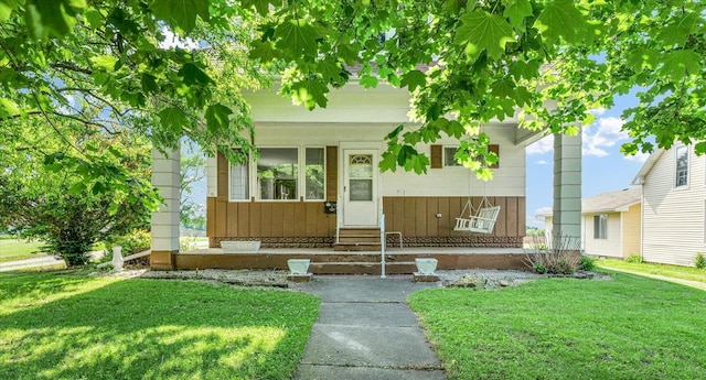 235 N Main St, Roberts, IL 60962 - view of front of home featuring a front lawn and entry steps