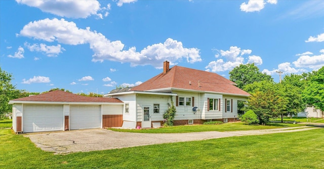 235 N Main St, Roberts, IL 60962 - back of property with a chimney and a lawn