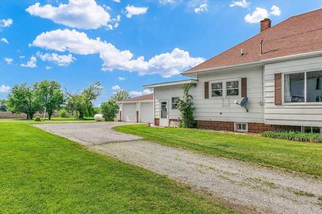 235 N Main St, Roberts, IL 60962 - view of side of property with a lawn and a chimney
