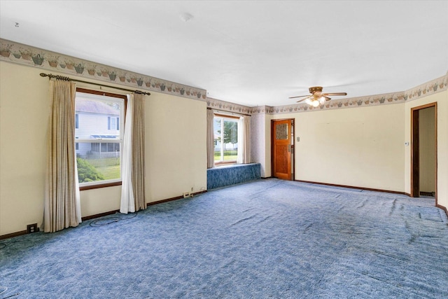 235 N Main St, Roberts, IL 60962 - spare room with carpet floors, ceiling fan, and baseboards