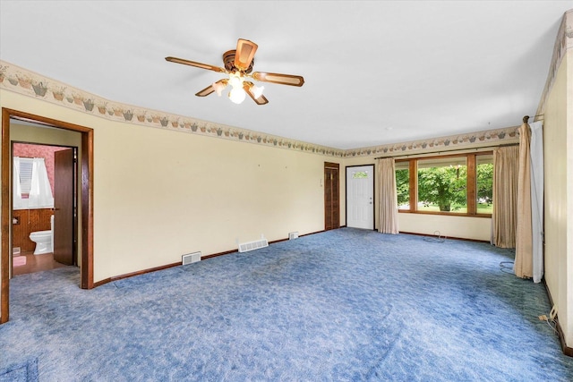 235 N Main St, Roberts, IL 60962 - carpeted spare room with ceiling fan and baseboards