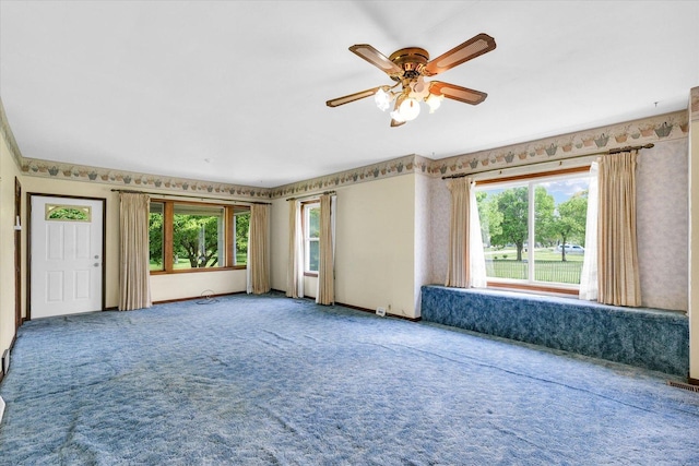 235 N Main St, Roberts, IL 60962 - carpeted spare room with ceiling fan and baseboards