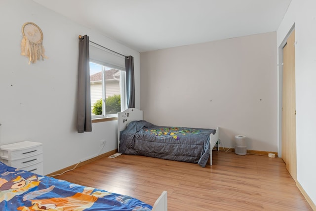 557 Sandy Ct, Harvard, IL 60033 - bedroom featuring light wood-style floors and baseboards