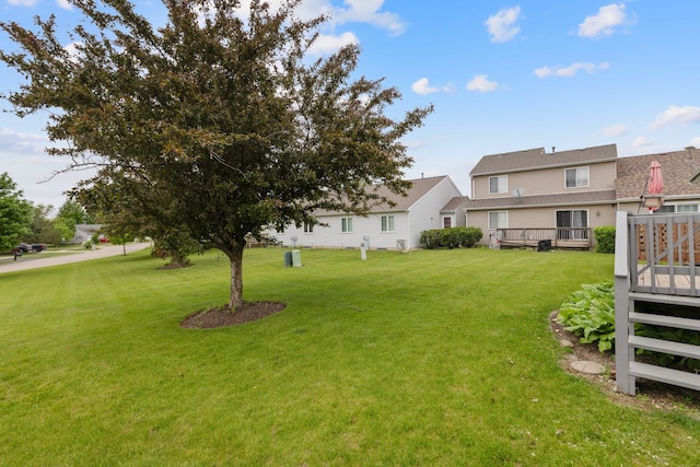 557 Sandy Ct, Harvard, IL 60033 - view of green lawn featuring a wooden deck