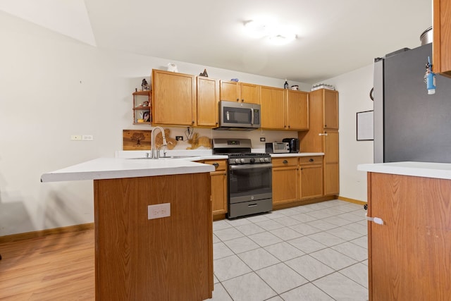 557 Sandy Ct, Harvard, IL 60033 - kitchen with stainless steel appliances, a peninsula, open shelves, light countertops, and a sink