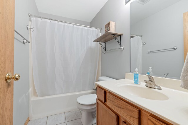 557 Sandy Ct, Harvard, IL 60033 - bathroom with toilet, tile patterned flooring, vanity, and shower / bath combo