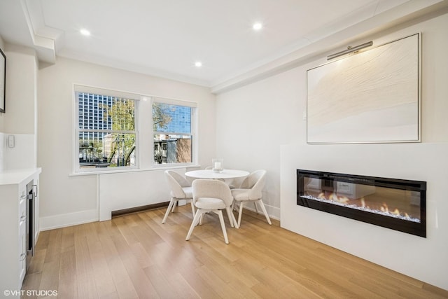 4300 N Marine Dr Unit 306, Chicago, IL 60613 - dining room with light wood-type flooring, a glass covered fireplace, recessed lighting, and baseboards