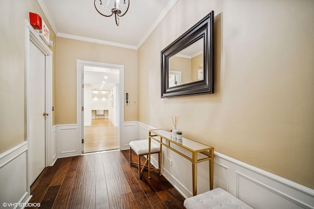 4300 N Marine Dr Unit 306, Chicago, IL 60613 - hall with wainscoting, dark wood-type flooring, ornamental molding, a chandelier, and a decorative wall