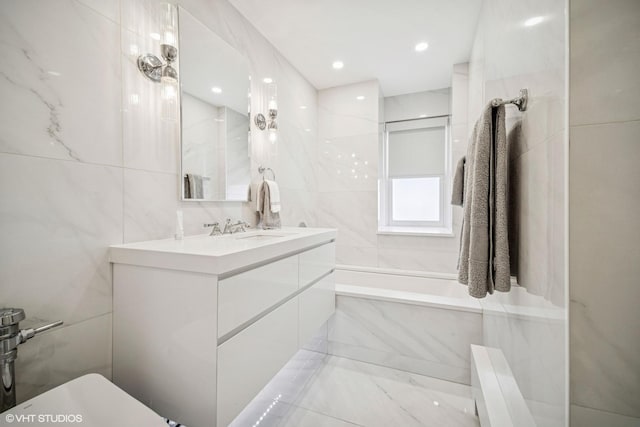 4300 N Marine Dr Unit 306, Chicago, IL 60613 - full bathroom featuring tile walls, marble finish floors, double vanity, and recessed lighting