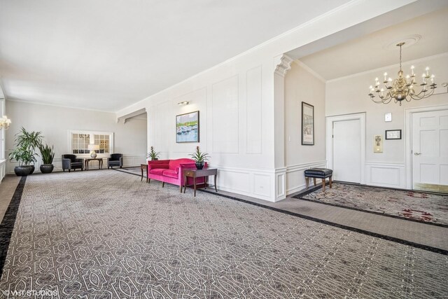 4300 N Marine Dr Unit 306, Chicago, IL 60613 - carpeted entryway with a chandelier, a decorative wall, and ornamental molding