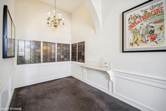 4300 N Marine Dr Unit 306, Chicago, IL 60613 - interior space with mail area, a decorative wall, a wainscoted wall, and dark colored carpet