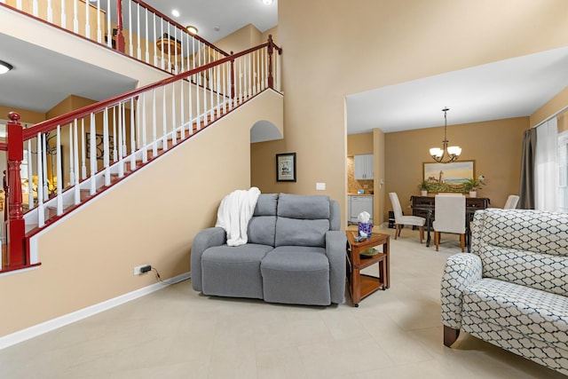 307 Lake Gillilan Way, Algonquin, IL 60102 - living area with a chandelier, a high ceiling, stairs, and baseboards