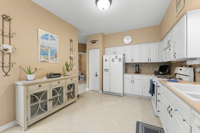 307 Lake Gillilan Way, Algonquin, IL 60102 - kitchen with white appliances, light countertops, decorative backsplash, and white cabinetry