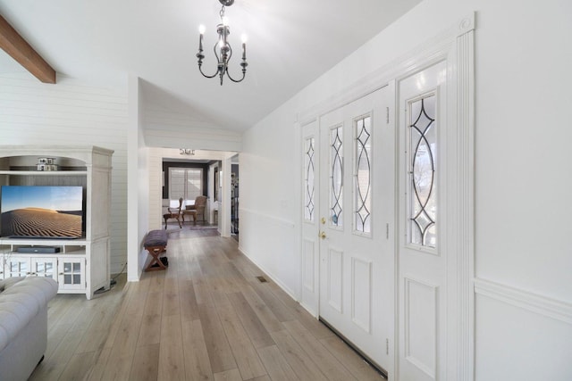 723 Beacon Dr, Lake Barrington, IL 60010 - foyer entrance featuring a chandelier and light wood-type flooring