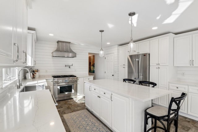 723 Beacon Dr, Lake Barrington, IL 60010 - kitchen with high quality appliances, custom exhaust hood, a sink, recessed lighting, and dark stone finish flooring