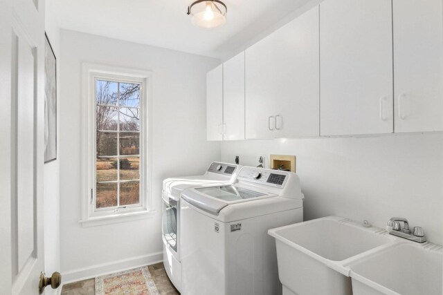 723 Beacon Dr, Lake Barrington, IL 60010 - laundry room featuring washing machine and dryer, cabinet space, and baseboards
