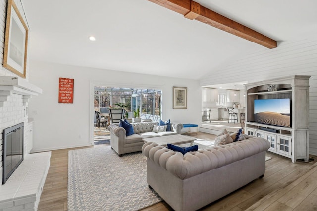 723 Beacon Dr, Lake Barrington, IL 60010 - living room with a fireplace, light wood-style flooring, and baseboards