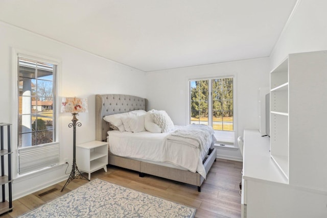723 Beacon Dr, Lake Barrington, IL 60010 - bedroom featuring multiple windows and wood finished floors