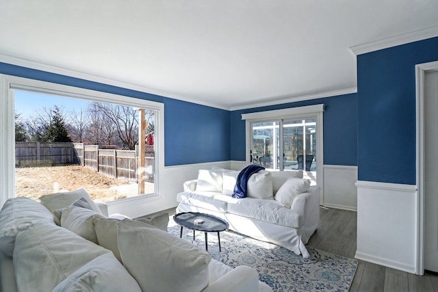 723 Beacon Dr, Lake Barrington, IL 60010 - living room featuring a wainscoted wall, crown molding, and wood finished floors
