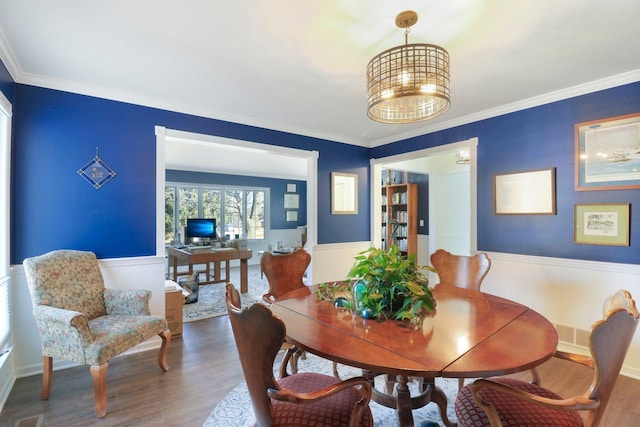 723 Beacon Dr, Lake Barrington, IL 60010 - dining room with wood finished floors, wainscoting, and crown molding