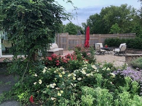 723 Beacon Dr, Lake Barrington, IL 60010 - view of yard with fence, a patio area, and a fire pit