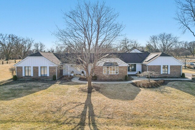 723 Beacon Dr, Lake Barrington, IL 60010 - ranch-style home with brick siding, board and batten siding, and a front yard