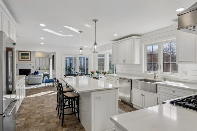 723 Beacon Dr, Lake Barrington, IL 60010 - kitchen with a sink, stainless steel appliances, a center island, recessed lighting, and light countertops