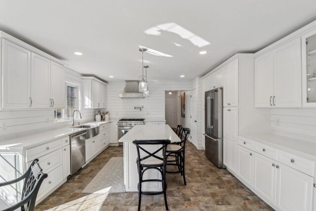 723 Beacon Dr, Lake Barrington, IL 60010 - kitchen featuring high quality appliances, a sink, stone finish floors, white cabinetry, and recessed lighting