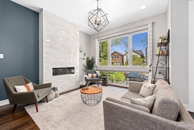 2629 W Homer St, Chicago, IL 60647 - living area featuring baseboards, a chandelier, a high end fireplace, and wood finished floors