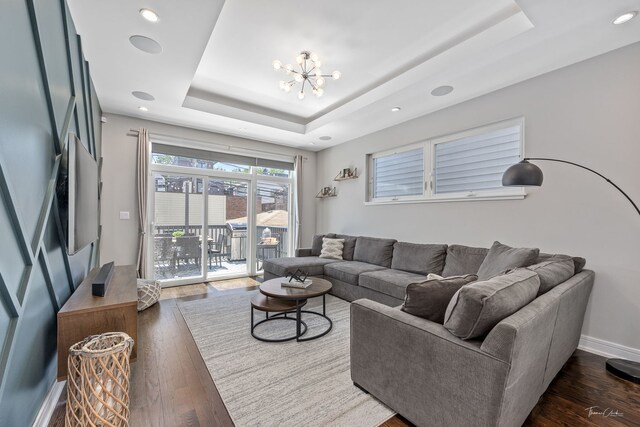 2629 W Homer St, Chicago, IL 60647 - living room with a raised ceiling, a chandelier, dark wood-style flooring, recessed lighting, and stairway