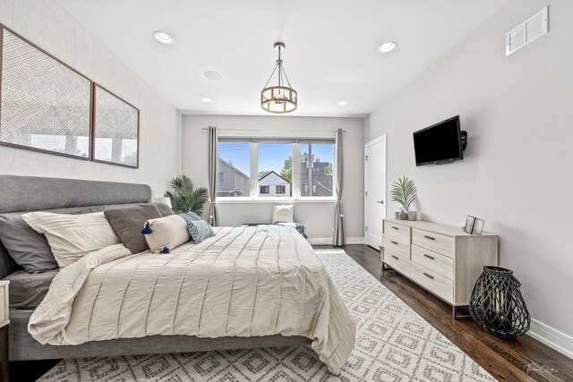 2629 W Homer St, Chicago, IL 60647 - bedroom featuring dark wood-style floors, a chandelier, baseboards, and recessed lighting