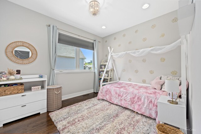 2629 W Homer St, Chicago, IL 60647 - bedroom with dark wood-style floors, wallpapered walls, baseboards, and recessed lighting