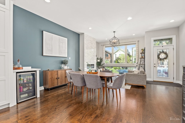 2629 W Homer St, Chicago, IL 60647 - dining area with wine cooler, a chandelier, recessed lighting, dark wood-type flooring, and baseboards