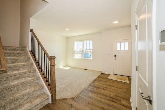 540 N Sycamore St, Hinckley, IL 60520 - entryway with wood finished floors, stairs, recessed lighting, and baseboards