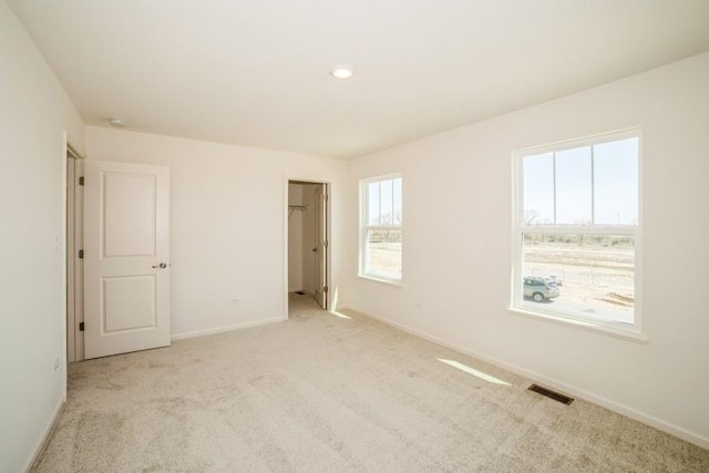540 N Sycamore St, Hinckley, IL 60520 - unfurnished bedroom with carpet flooring, baseboards, and a walk in closet