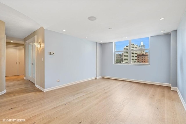 40 E Cedar St Unit 8Cd, Chicago, IL 60611 - spare room featuring light wood-style floors and recessed lighting